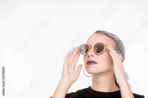 White female looking up with sunglasses