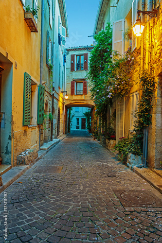 Fototapeta Naklejka Na Ścianę i Meble -  Narrow street in the old town Antibes in France. Night view