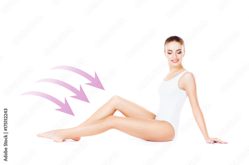 Fototapeta premium Beautiful fit girl posing on isolated background with drawing arrows. Health, sport, fitness, nutrition, epilation, cellulite and hair removal, liposuction, healthy life-style concept.