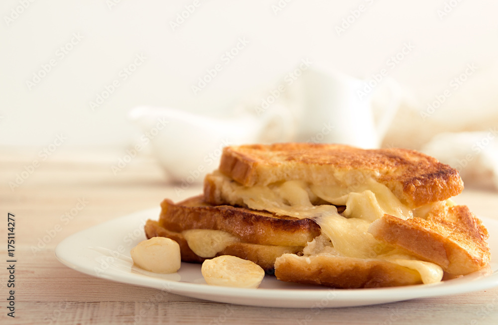 Italian toast sandwich with white bread and mozzarella cheese fried in oil. Mediterranean meal.