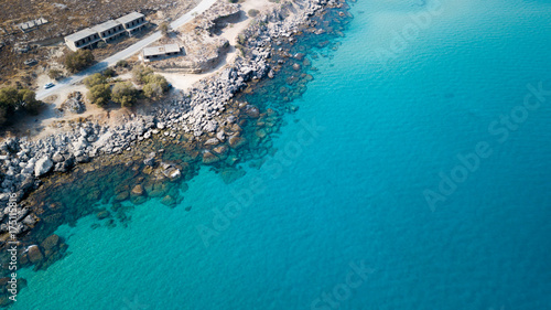 Aerial View: Drone video of iconic beach of Agathi and castle of Feraklos, Rodos island, Aegean, Greece photo