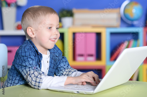 boy using laptop 