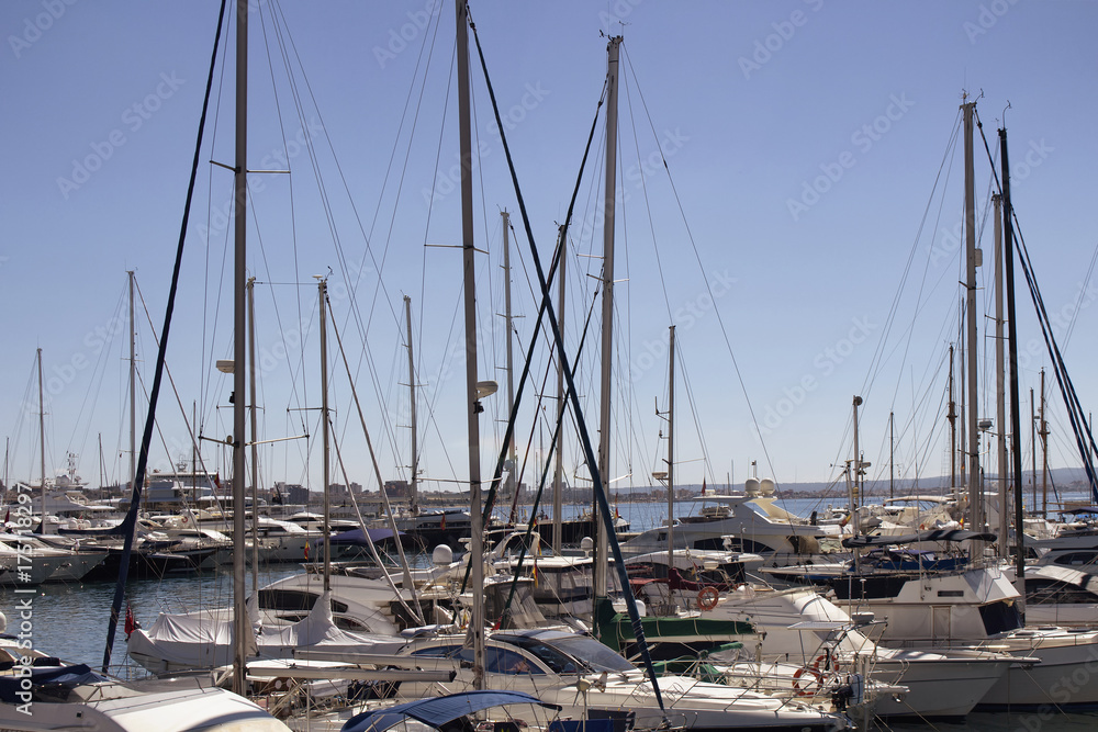 View of many yachts parked at Palma de Mallorca marina. It's a resort city and capital of the Spanish island of Majorca in the western Mediterranean.