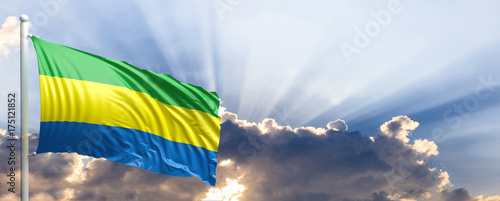 Gabon flag on blue sky. 3d illustration photo