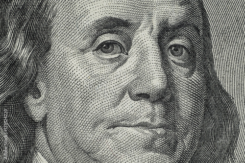Close up on US dollar banknotes. Portrait of Franklin on US dollar Banknotes. Shooting by 1:1 Macro lense.