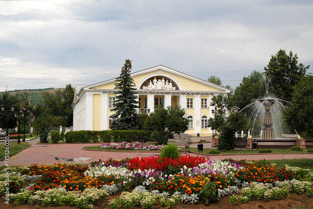 fountain before  building in  Soviet classical style in  summer the city Asha of Russia