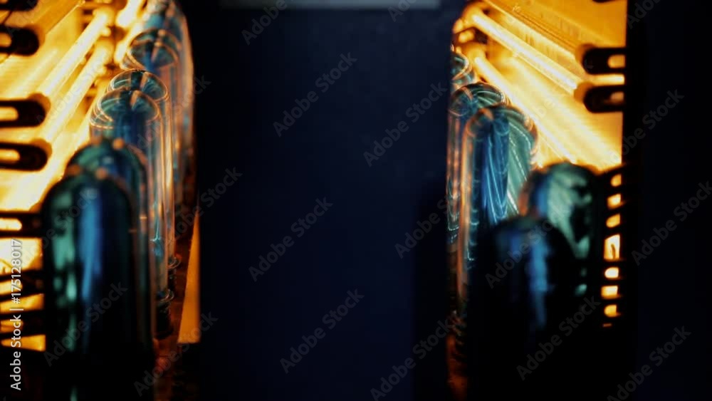 Plastic preforms pass through an infrared chamber for heating. Preform