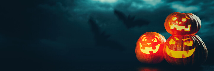 Three halloween Jack O' Lantern pumpkins