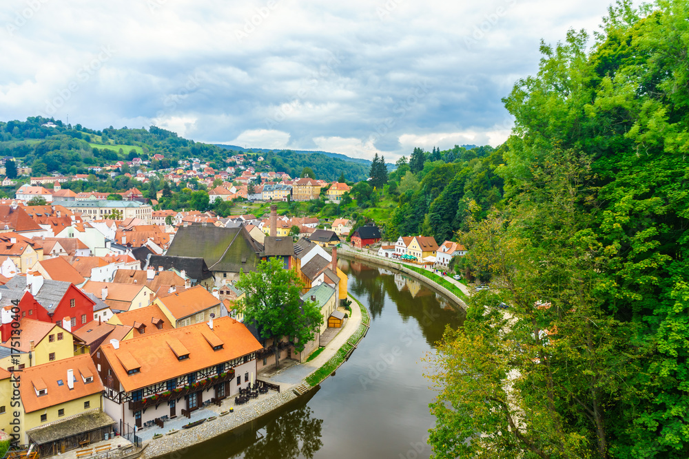 Castle Krumlov and Cesky Krumlov. Medieval fortress and the river Vltava. Red tile and narrow streets. Houses made of stone. The Rim of the River