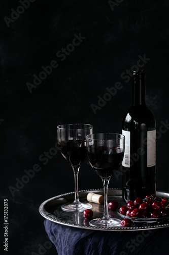 Bottle with red wine and glasses