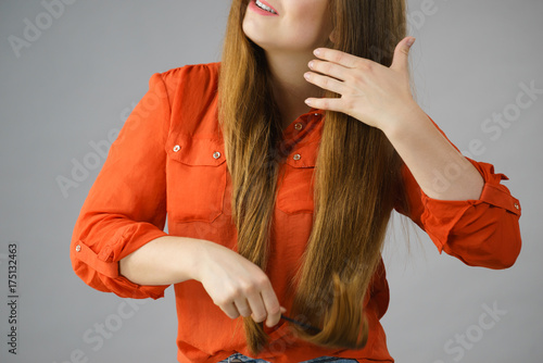 Woman combing her brown hair