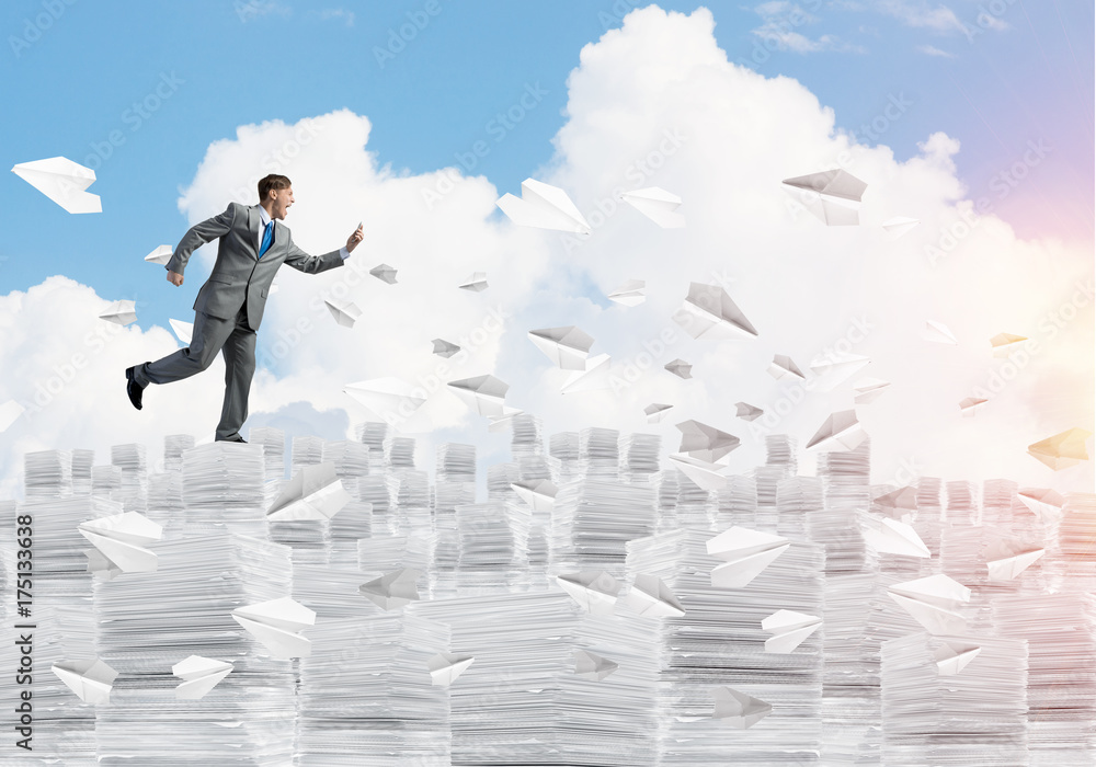 Precise businessman in suit running with phone. Precise businessman in suit running with phone.