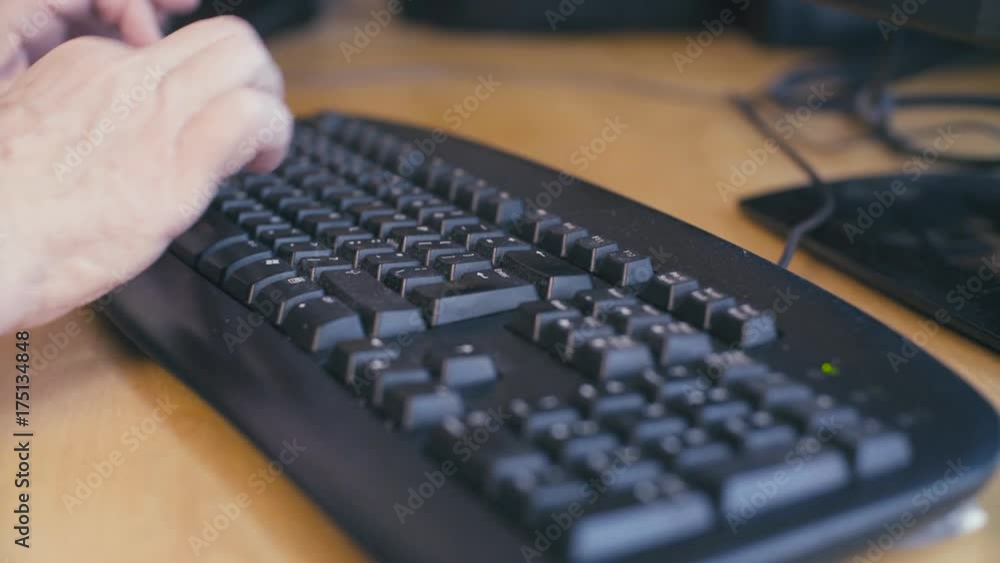 Hands of old woman typing on a computer keyboard Hands of old woman typing on a computer keyboard