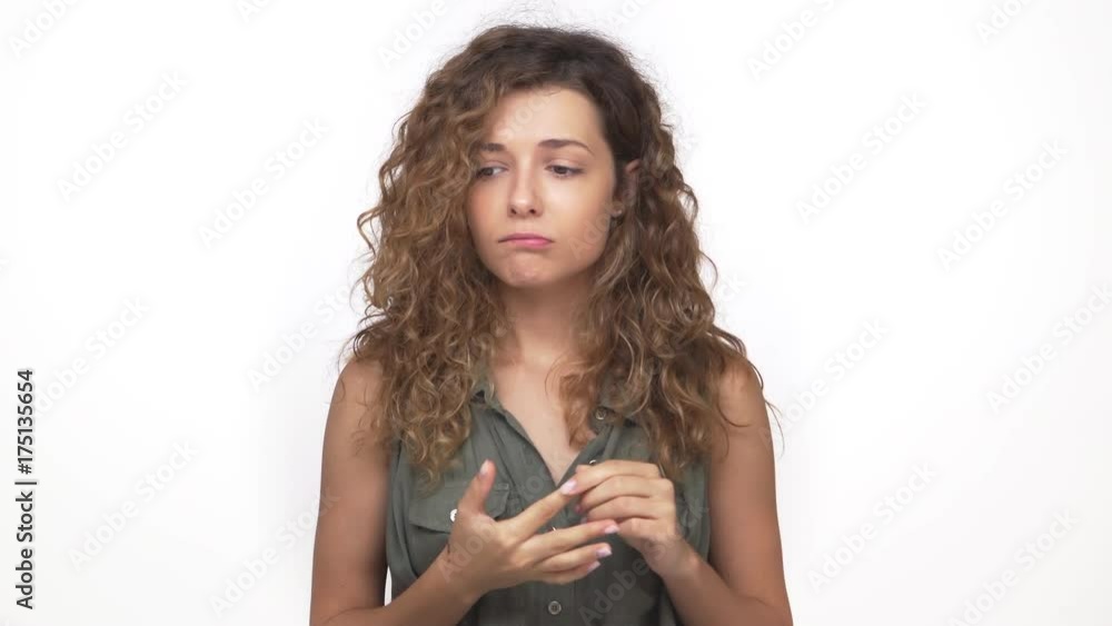 pretty lady in grey shirt expressing anxiety worrying feeling stressed closeup isolated over white background. Concept of emotions pretty lady in grey shirt expressing anxiety worrying feeling stressed closeup isolated over white background. Concept of emotions