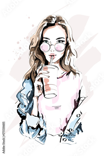 Fototapeta samoprzylepna Hand drawn beautiful young woman portrait. Fashion girl with coffee cup. Stylish woman in sunglasses. Sketch.