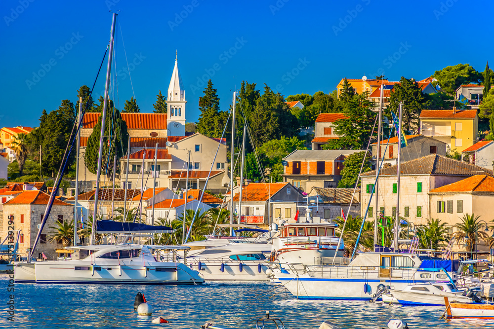 Obraz premium Town Rogoznica Mediterranean scenery. / Seafront view at amazing colorful town Rogoznica, popular tourist resort and sailing luxury resort in Dalmatia region, Mediterranean. 