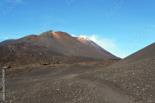 Moon-like landscape of Mount Etna with smoke from the crater  Sicily  Italy
