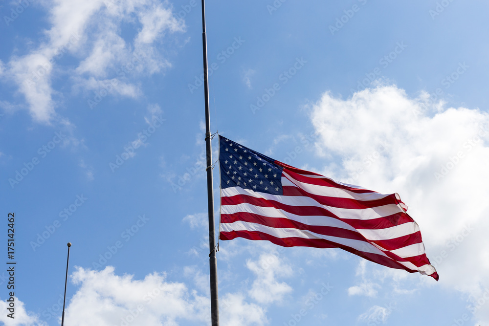United States flag flying at a half-staff United States flag flying at a half-staff