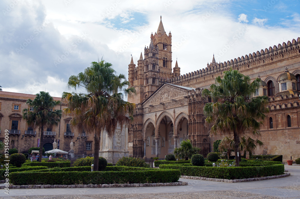 Palermo Cathedral surrounded by palms of green square, Sicily, Italy