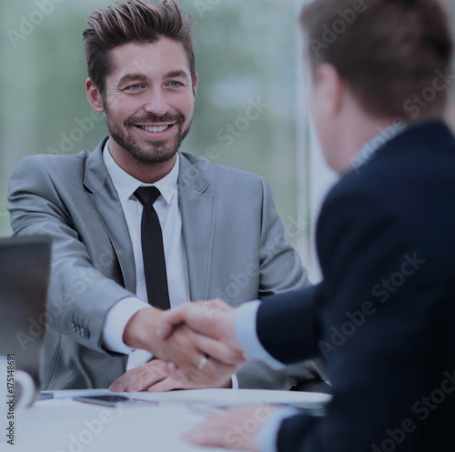 Wallpaper Mural Business handshake. Two business people shaking hands in office. Torontodigital.ca