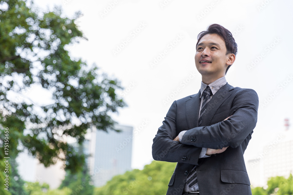 portrait of young asian businessman in park portrait of young asian businessman in park