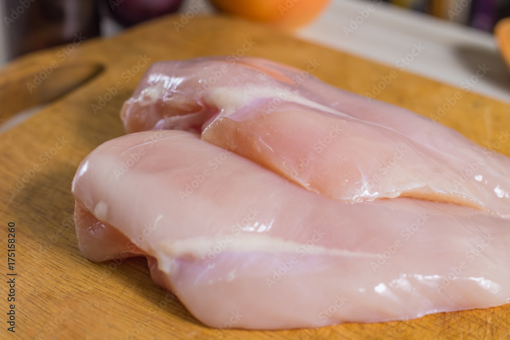 The Raw chicken breast with dill ready to cooking The Raw chicken breast with dill ready to cooking