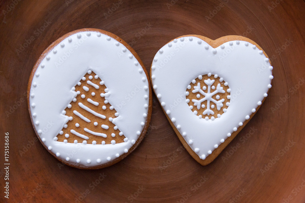 gingerbread with a painted white glaze Christmas tree and with a painted white icing heart gingerbread with a painted white glaze Christmas tree and with a painted white icing heart