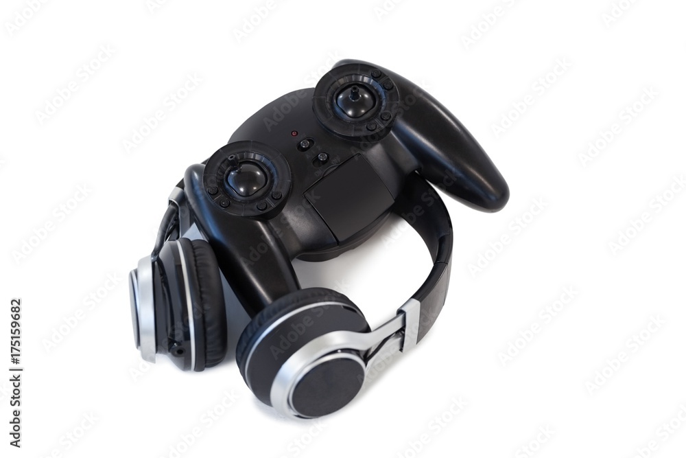 Joystick and headphones on white background Joystick and headphones on white background