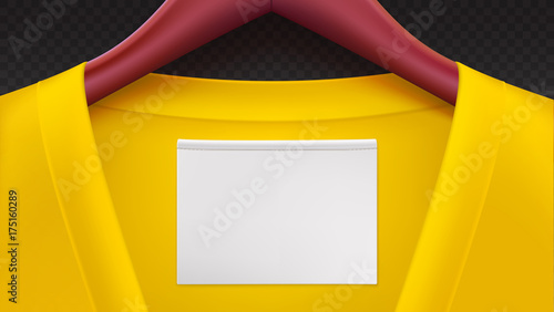 Wooden clothes hangers with yellow clothes, empty tag on the collar. Horizontal template on transparent background for advertising of sales or new arrivals. Place for your text on white tag.