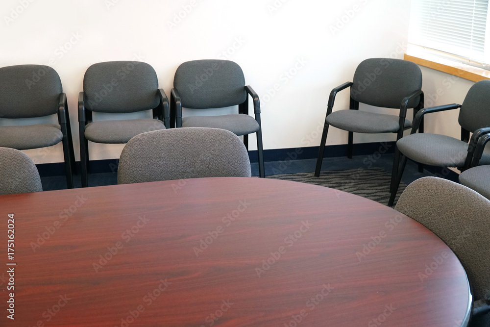 Close up on meeting room with meeting table and chairs Close up on meeting room with meeting table and chairs