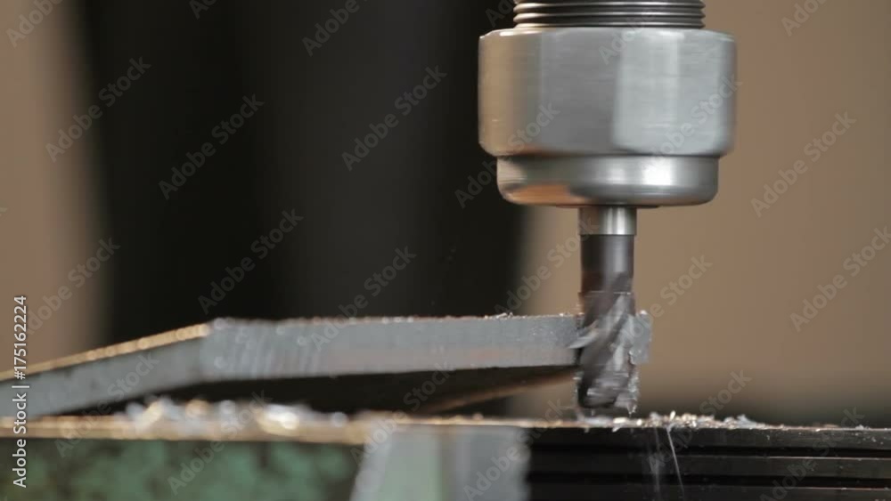 The milling machine makes a metal part. Close-up. The milling machine makes a metal part. Close-up.