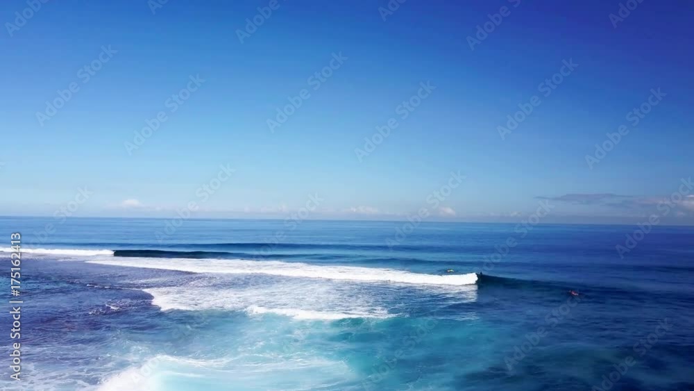 Waves crash on French Polynesia island, aerial Waves crash on French Polynesia island, aerial