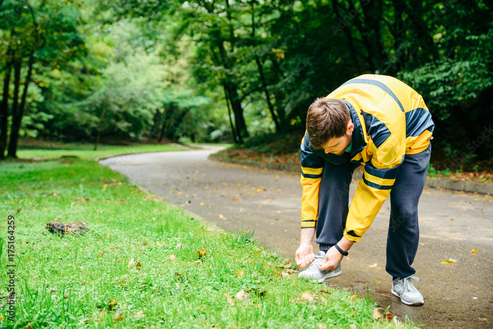 Running and sport concept.Sportsman hands tying shoelaces. Running and sport concept.Sportsman hands tying shoelaces.