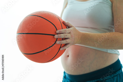 Pregnant woman with basketball © Bits and Splits