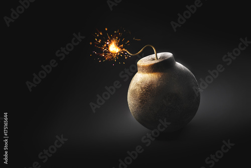 round bomb with lit fuse on a dark background /3D illustration /3D Rendering photo