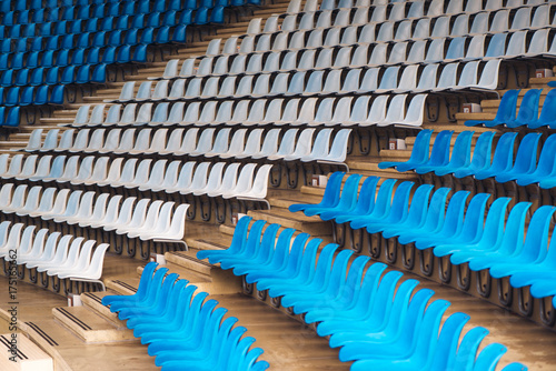 Blue and white plastic stadium seats