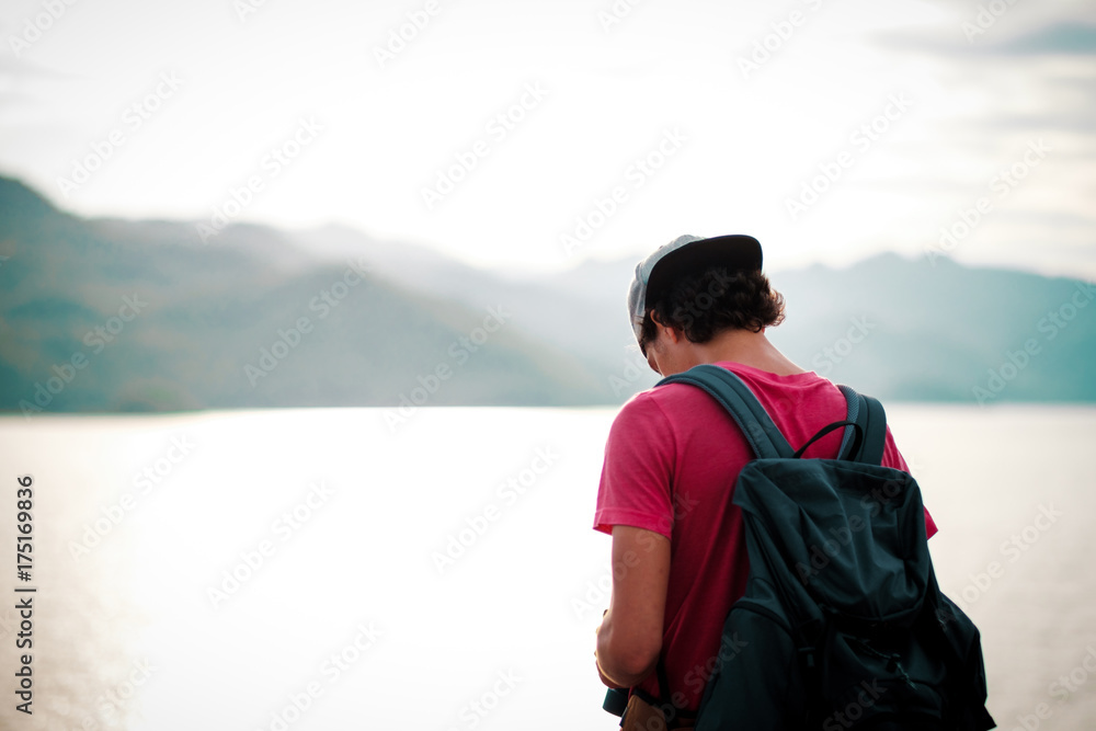 Man traveler traveling walking with backpack at the jungle on holiday at weekend on background nature view Man traveler traveling walking with backpack at the jungle on holiday at weekend on background nature view