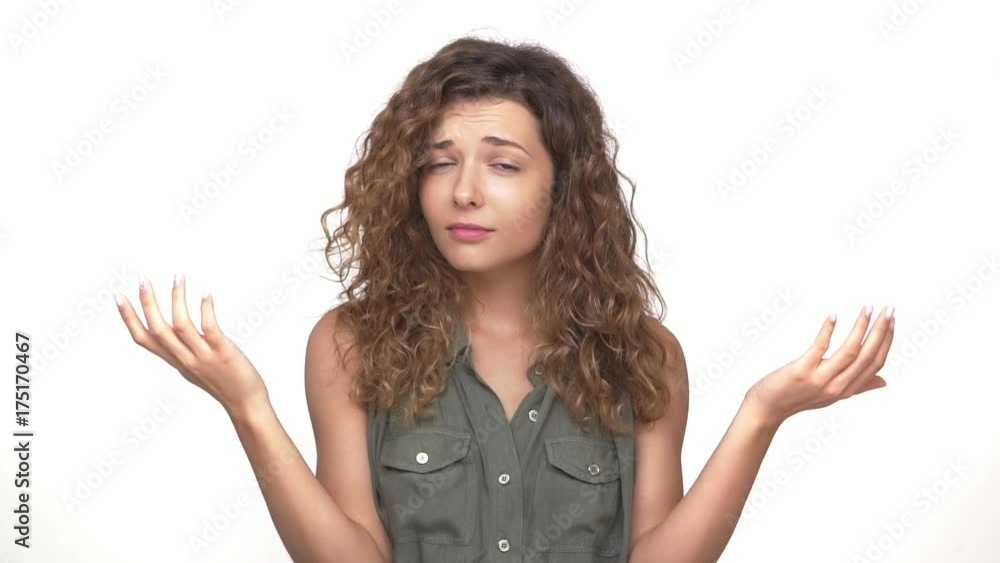 sarcastic young woman throwing up hands to sides doing refusal gesture