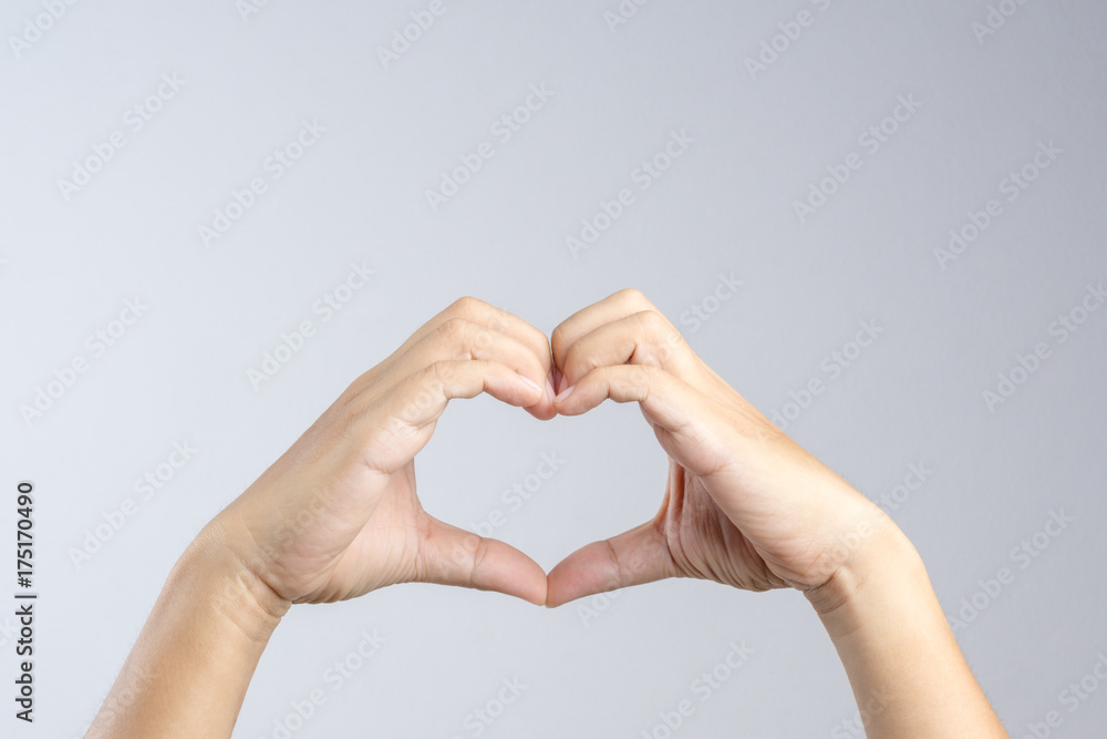 Obraz premium Hand making a heart shape, love and relationship gesture concept