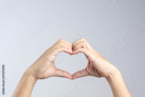 Hand making a heart shape  love and relationship gesture concept