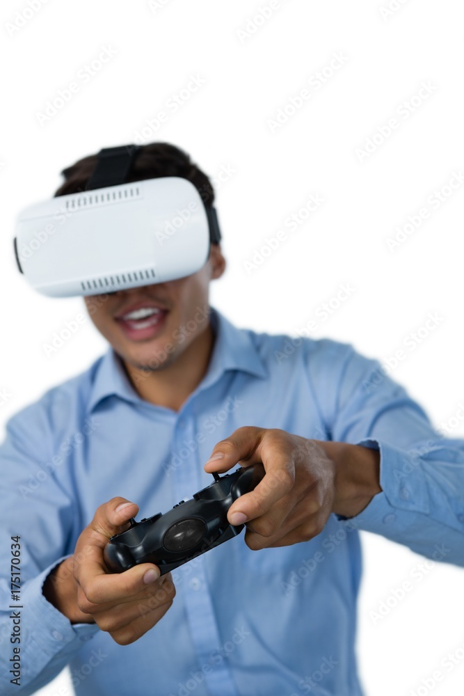 Young businessman wearing vr glasses while playing video game Young businessman wearing vr glasses while playing video game