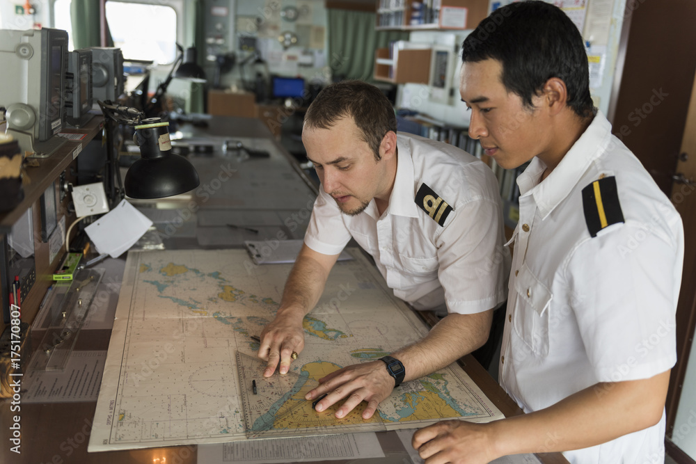 Senior Navigation Officer Training a Junior Officer - obrazy, fototapety, plakaty 