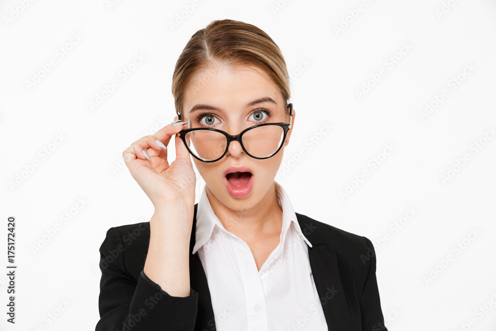 Close up picture of Surprised blonde business woman in eyeglasses