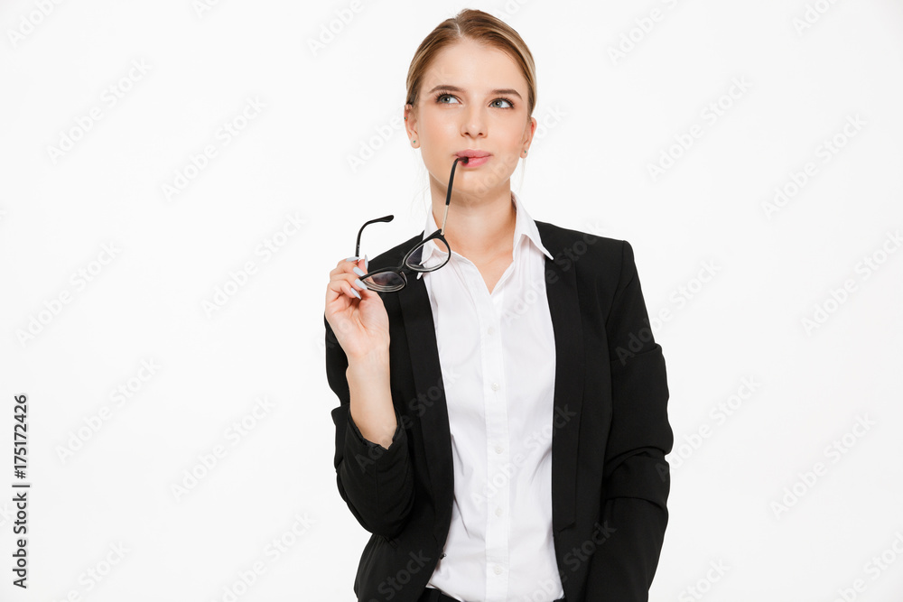 Sly pensive blonde business woman holding eyeglasses and looking up Sly pensive blonde business woman holding eyeglasses and looking up