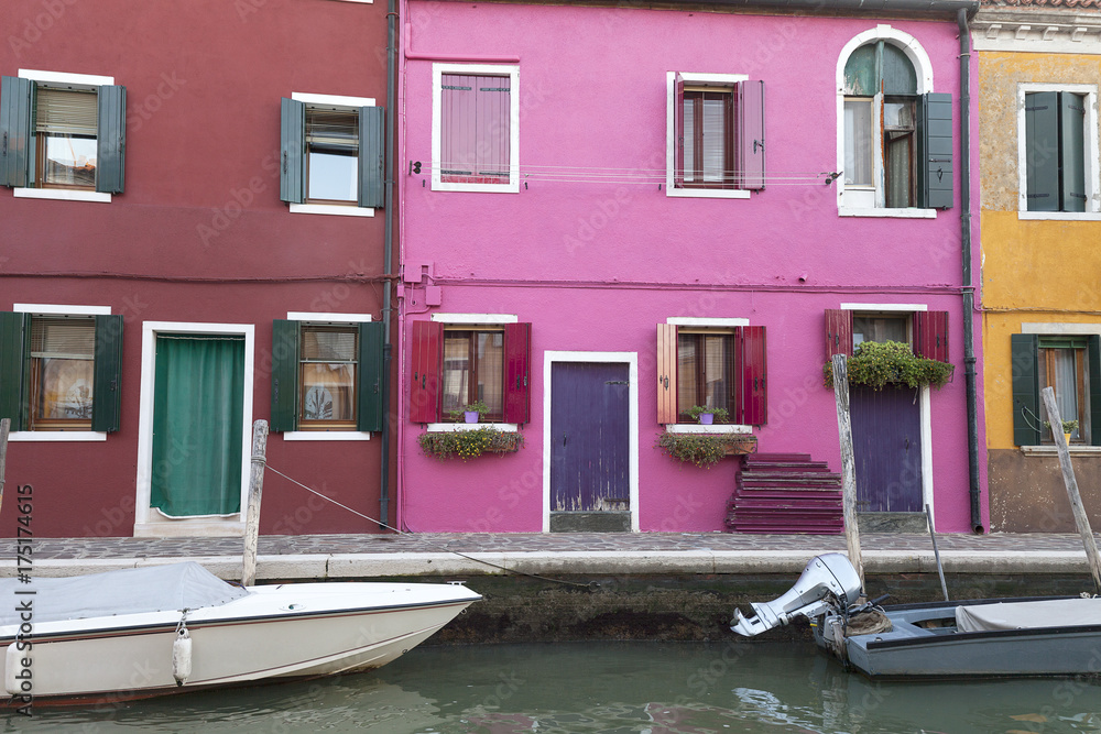 Colorful small, brightly painted houses on the island of Burano, Venice, Italy Colorful small, brightly painted houses on the island of Burano, Venice, Italy
