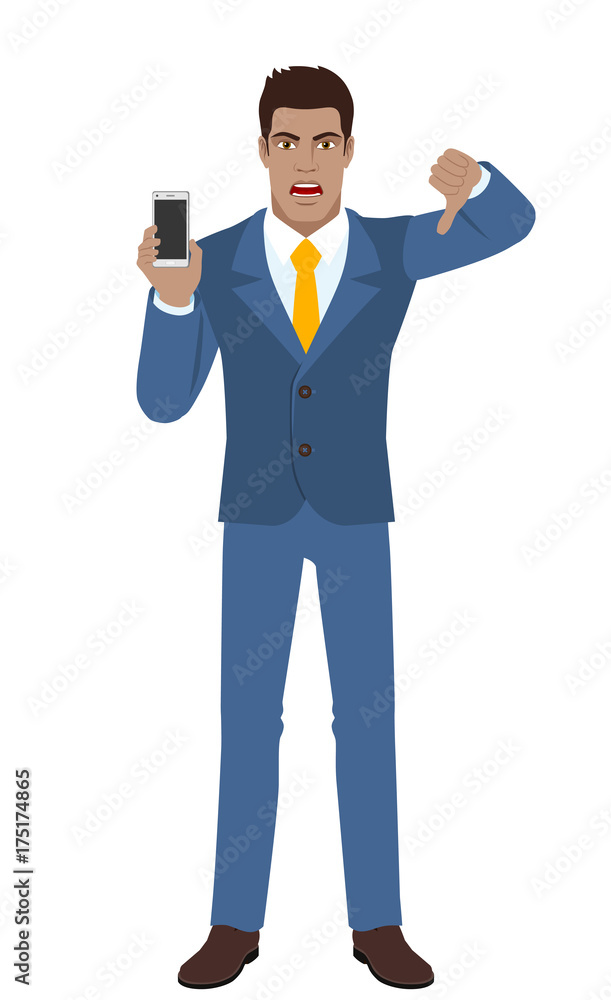 Businessman holding a mobile phone and showing thumb down gesture as rejection symbol Businessman holding a mobile phone and showing thumb down gesture as rejection symbol