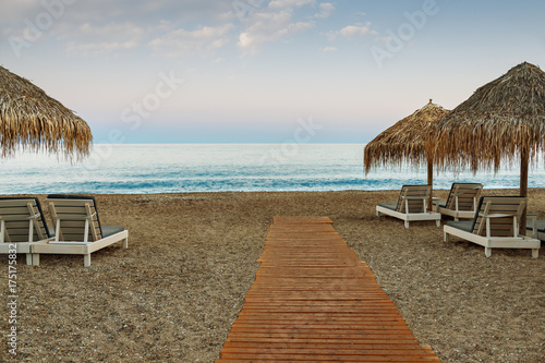 Umbrellas and beds, beaches of Greece