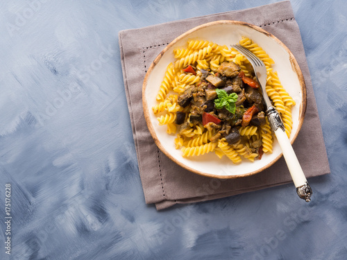 Fusilli pasta with eggplant and tomato sauce. Traditional italian dish