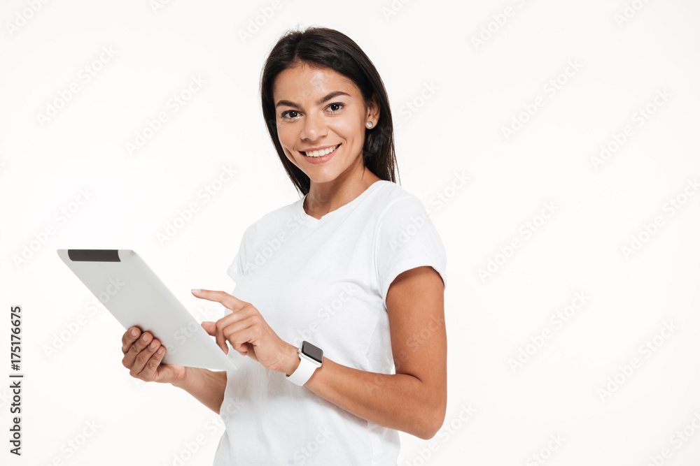 Portrait of an attractive young woman holding tablet computer Portrait of an attractive young woman holding tablet computer