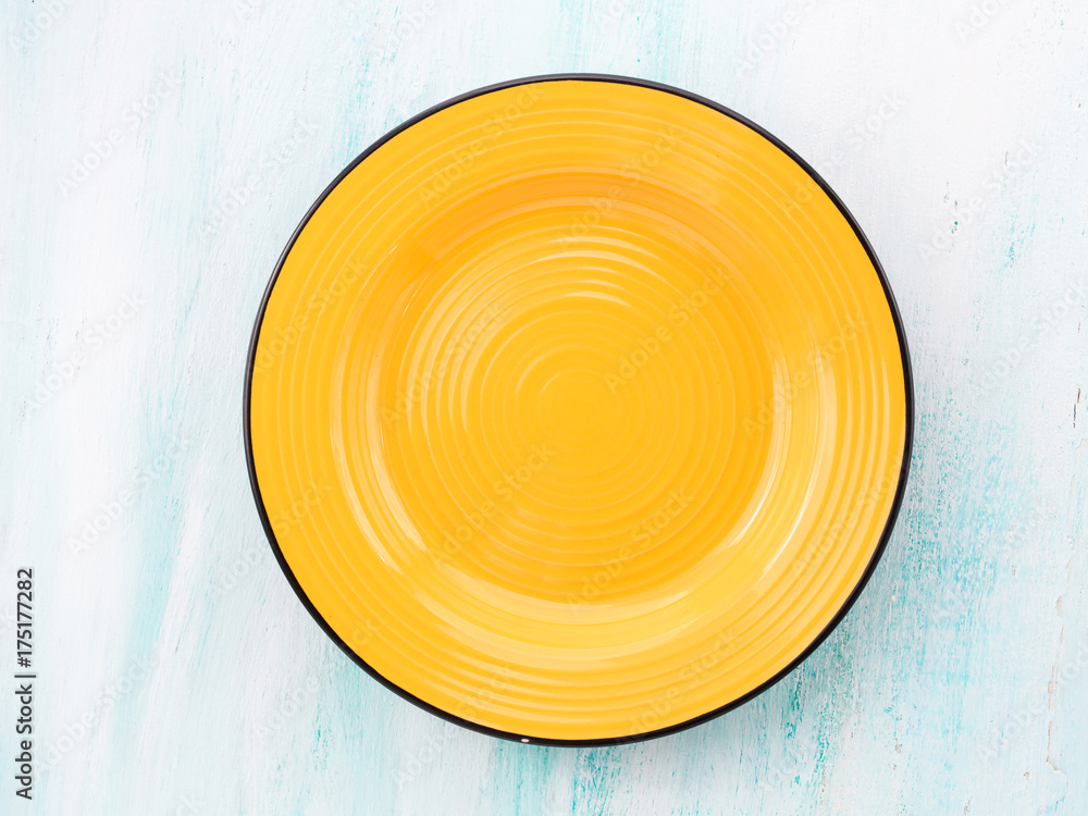 Pastel Color yellow ceramic plate dish top view background Pastel Color yellow ceramic plate dish top view background